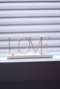 Golden love signage on the window