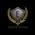 Golden Luxury Shield E Letter Logo.