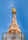 Golden Madonna statue on top of Milan Cathedral, Italy