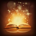 Golden magic book and sparkles