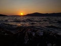 Golden Majesty: Serene Sunset Over Sea and Mountains