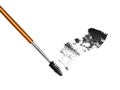 Golden mascara brush with black strokes isolated on white