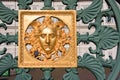 Golden mask on fence - Royal Palace Turin, Italy