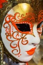 Golden mask with orange arabesques, Venice, Italy, Europe