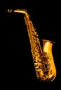 Golden matte finished alto saxophone on black background Royalty Free Stock Photo