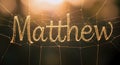 Golden Matthew Name on a Spider Web â Enchanting Typography Digital Illustration Royalty Free Stock Photo