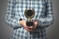 Golden medal award trophy in female hand Royalty Free Stock Photo