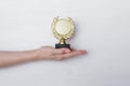 Golden medal trophy in hand. Royalty Free Stock Photo