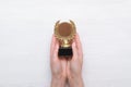 Golden medal trophy in hand. Royalty Free Stock Photo