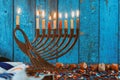 Golden menorah with flaming candles in the Chanukah