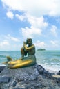 Golden mermaid statues on Samila beach. Landmark of Songkla, Thailand