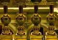 Golden metal balusters close up.