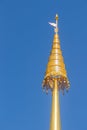 Golden metal chatra on the top of the church in Buddhist temple in Northern Thailand. It is an auspicious symbol in Hinduism and B