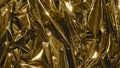 Golden metal foil, wrinkled and shiny. Close-up, abstract image background Royalty Free Stock Photo