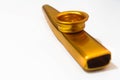 Golden Kazoo Musical Instrument White Background