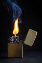 Golden Metal lighter and smoke Royalty Free Stock Photo
