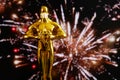 Hollywood Golden Oscar Academy award statue in medical mask. Success and victory concept. Oscar ceremony in coronavirus time