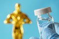 Hollywood Golden Oscar Academy award statue and hand in gloves with vaccine aganist coronavirus on blue background. Success and vi Royalty Free Stock Photo