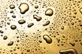 Golden metal water drops on  reflective surface Royalty Free Stock Photo