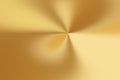 Golden metallic surface showing radial light and shadow creating vibrant abstract background Royalty Free Stock Photo