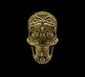 Golden mexican skull on black background