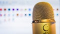 Golden microphone close up with computer main screen background Royalty Free Stock Photo