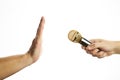 The golden microphone at hand and stop palm gesture. yellow gossip information concept. copy space