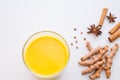 Golden Milk Turmeric Latte on white background with spices