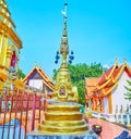 The mini-chedi with bells on hti umbrella, Wat Muen Ngoen Kong, Chiang Mai, Thailand Royalty Free Stock Photo