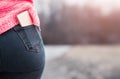 Golden mobile phone in the woman`s back pocket Royalty Free Stock Photo