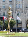 Golden modern stylized sculpture in front of the Grescham palace to Budapest in Hungary.