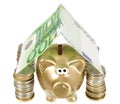 A golden moneybank under house made from banknote Royalty Free Stock Photo