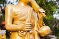 Golden monk on pilgrimage statue Royalty Free Stock Photo