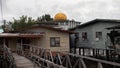 Golden Mosque Dome Above Poor Poverty Village Disrepair Run Down