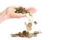 Gold coins pour out of hands on a pile of gold coins isolated on a white background Royalty Free Stock Photo