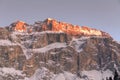 A close up of a golden mountain peak during a winter sunset in Dolomiti Superski resort, Italy Royalty Free Stock Photo