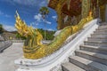 Golden naga King Cobras decorate teh stairs of Haw Pha Bang or Palace Chapel at the Royal Palace Museum in Luang Prabang, Laos Royalty Free Stock Photo