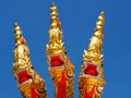 Golden Nagas soaring into blue sky