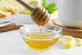 Golden natural honey autumn winter hot drink ingredient glass bowl honey spoon seasonal