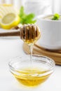 Golden natural honey autumn winter hot drink ingredient glass bowl honey spoon seasonal