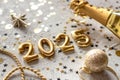 Golden 2025 new year numbers with confetti and champagne bottle