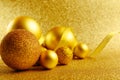 Golden New Year tree toys with glitter background. Xmas decorations. Winter holidays backdrop with copyspace. Christmas