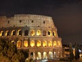 Golden night view of The Colosseum in Rome