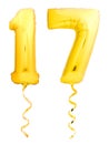 Golden number 17 seventeen made of inflatable balloon with ribbon isolated on white Royalty Free Stock Photo