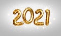 2021 Golden Numbers. Happy New Year 2021 and Christmas greeting card design with glittering confetti of bokeh lights and sparkling Royalty Free Stock Photo