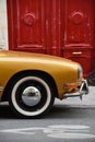 Golden Old Timer Volkswagen with Reflection of Apartment Buildings in Le Marais District, Paris, France Royalty Free Stock Photo