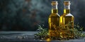 Golden olive oil and vinegar bottles with thyme and aromatic herbs leaves Royalty Free Stock Photo