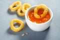 Golden onion rings and ketchup