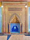 Golden ornate arched mihrab niche with floral pattern, blue Turkish ceramic tiles and arabic calligraphy, Cairo, Egypt