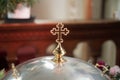 Golden Orthodox cross in the church, a symbol of baptism